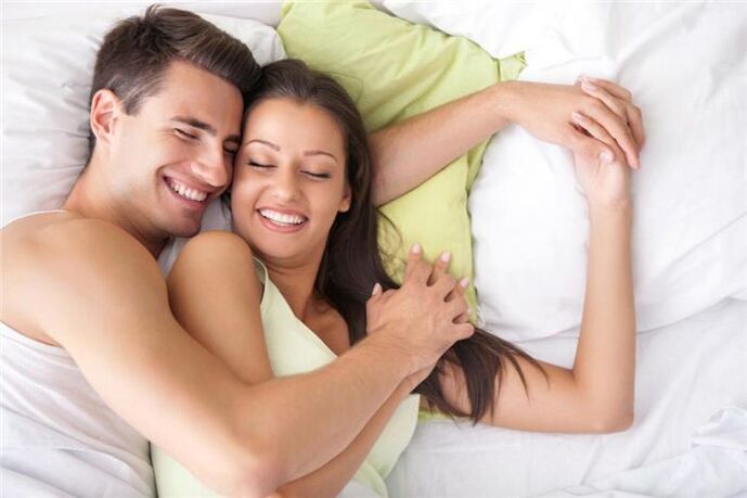 happy couple in bed